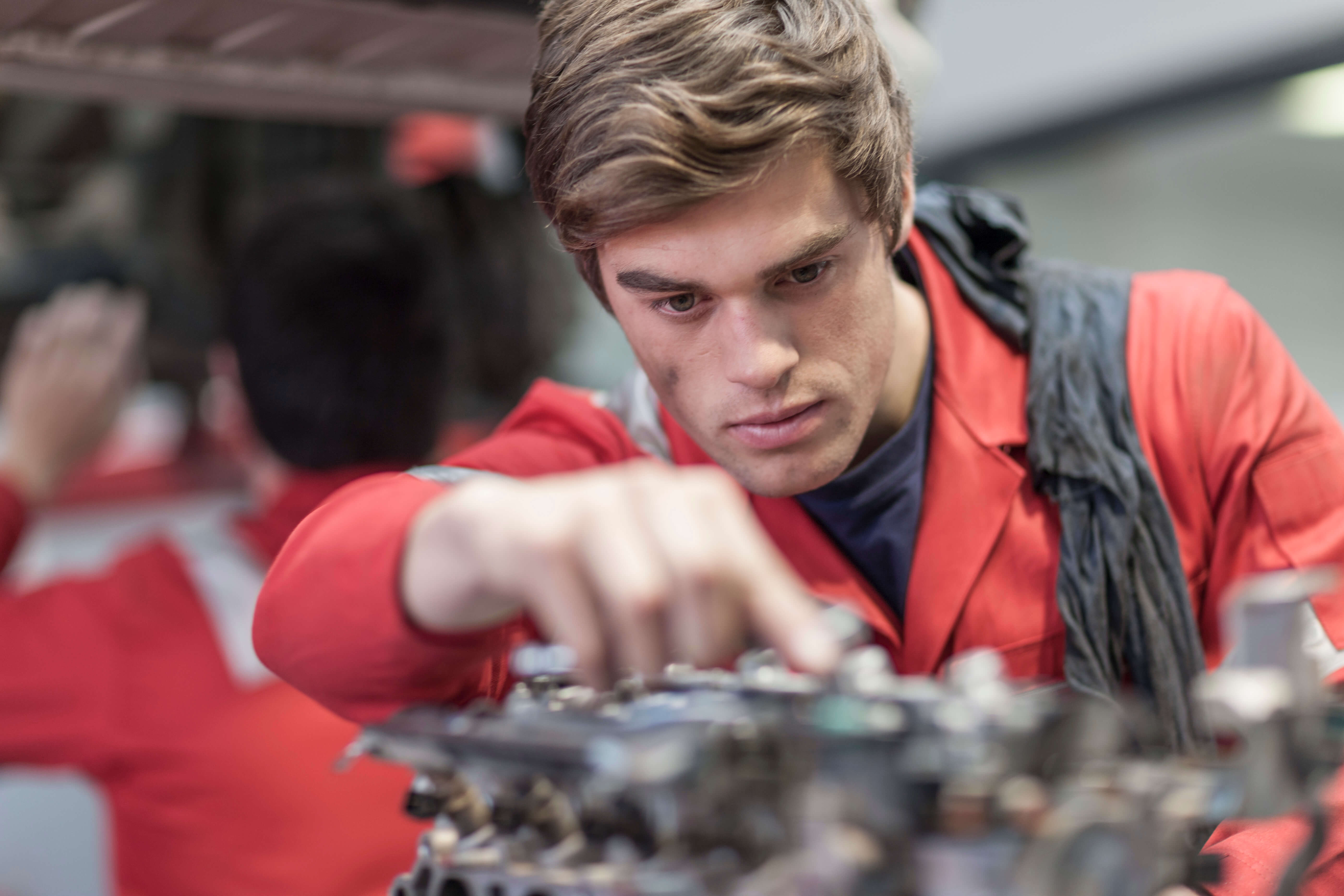 Car mechanic at work in repair garage